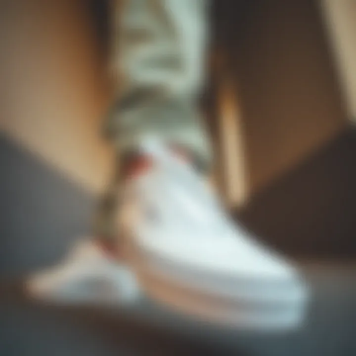 Fashion Meets Functionality A fashion-forward individual styling all white Vans with contemporary attire.