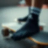 Black Adidas no show socks on a skateboard deck