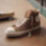 A close-up of stylish brown Converse sneakers on a skateboard