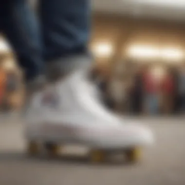 Close-up of Chuck Taylor white leather sneakers on a skateboard