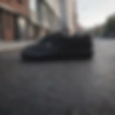 Showcasing Durability of Black Vans Durable black Vans showcased on a flat surface