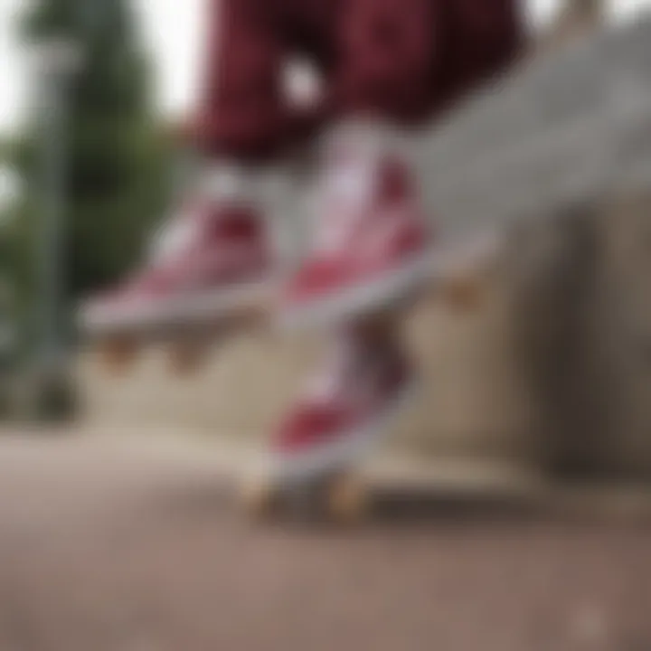 Skateboarders wearing maroon and white Vans in action