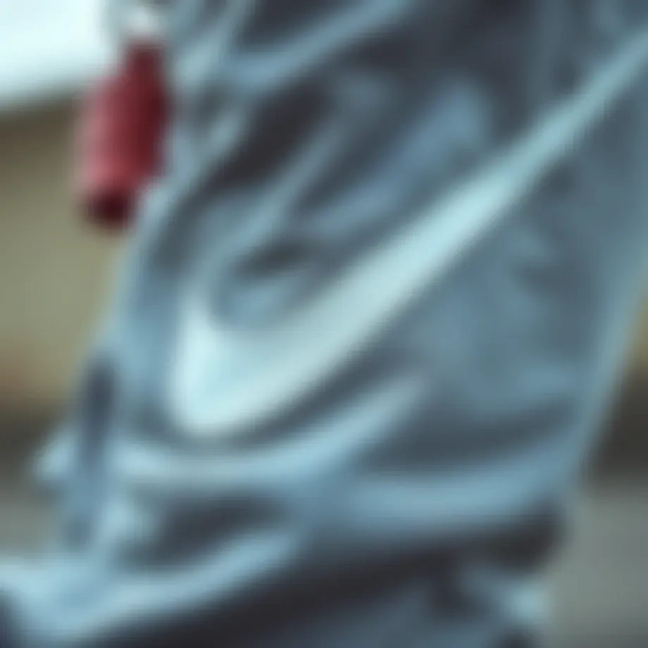 Close-up of Nike Swoosh logo on sweatpants