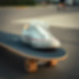 A close-up of White Converse shoes on a skateboard