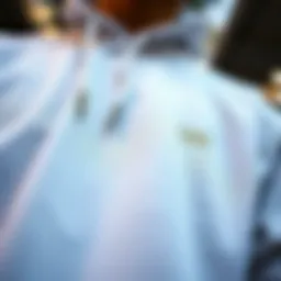 A close-up of a white Vans sweatshirt showcasing intricate stitching and design elements