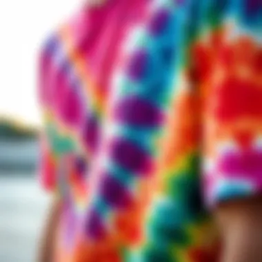 A close-up of a colorful tie-dye t-shirt worn by a skateboarder.