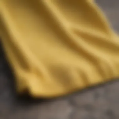 Close-up of the fabric texture and design details of yellow Vans shorts.