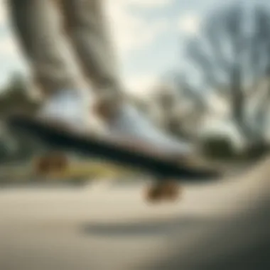 Skateboarder in White Leather Convers Skateboarder wearing white leather Convers at a skate park