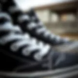 Detail of Vans black high top sneaker design showcasing unique stitching and materials.