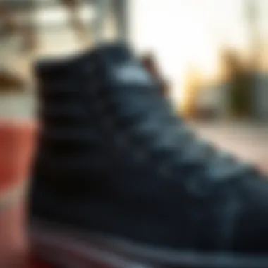 Craftsmanship of Vans Black High Top Sneakers Close-up of Vans black high top sneaker, emphasizing the brand logo and craftsmanship.