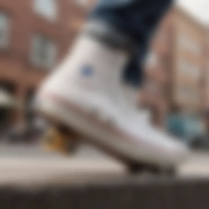 Skateboarder performing a trick while wearing Chuck Taylor white leather sneakers