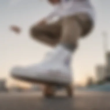 A skateboarder performing tricks while wearing all white Chuck Taylor Converse