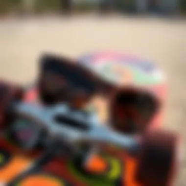 Close-up of a trendy skateboard deck and unconventional sunglasses intertwined