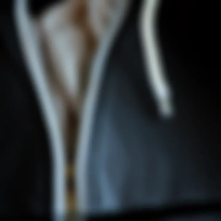 Fabric Detail of Zip-Up Hoodie Close-up of the fabric texture of a black and white zip-up hoodie.