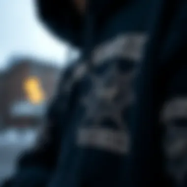 A close-up view of the Hundreds black hoodie showcasing its intricate design elements.