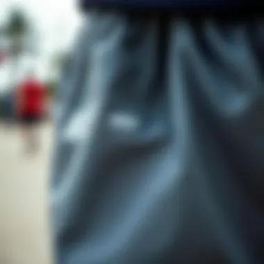 Craftsmanship: Exploring the Material of Nike Shorts Close-up of the fabric and stitching of grey Nike shorts designed for skateboarding