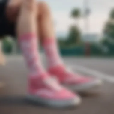 A close-up of pink Vans socks showcasing their unique design.