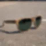 A close-up look at stylish pit viper sunglasses placed on a skateboard deck.